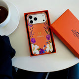 Hermès Floral Signature Case with Wrist Charm for iPhone 13 to 17 Pro Max